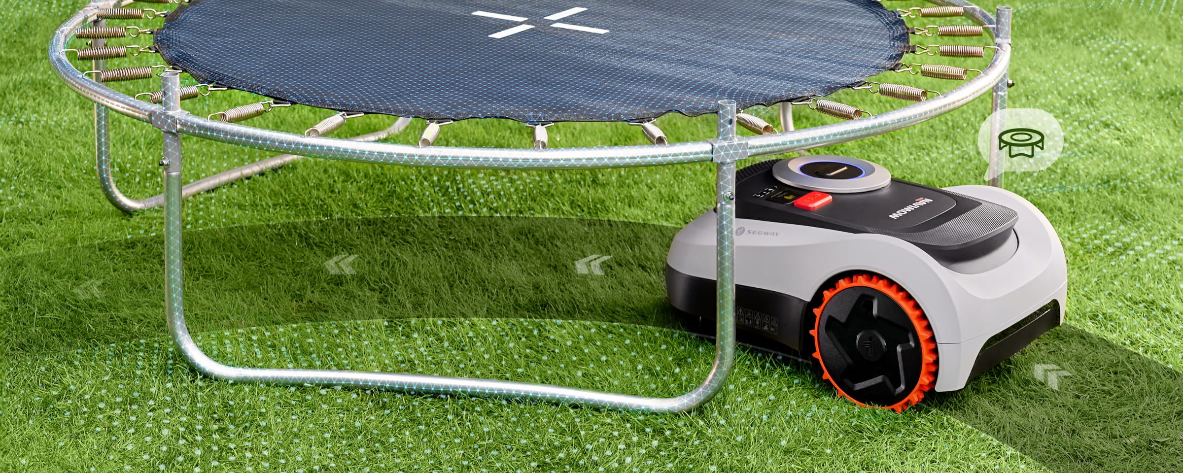 Segway Navimow i105E robot lawn mower trims grass under trampoline.