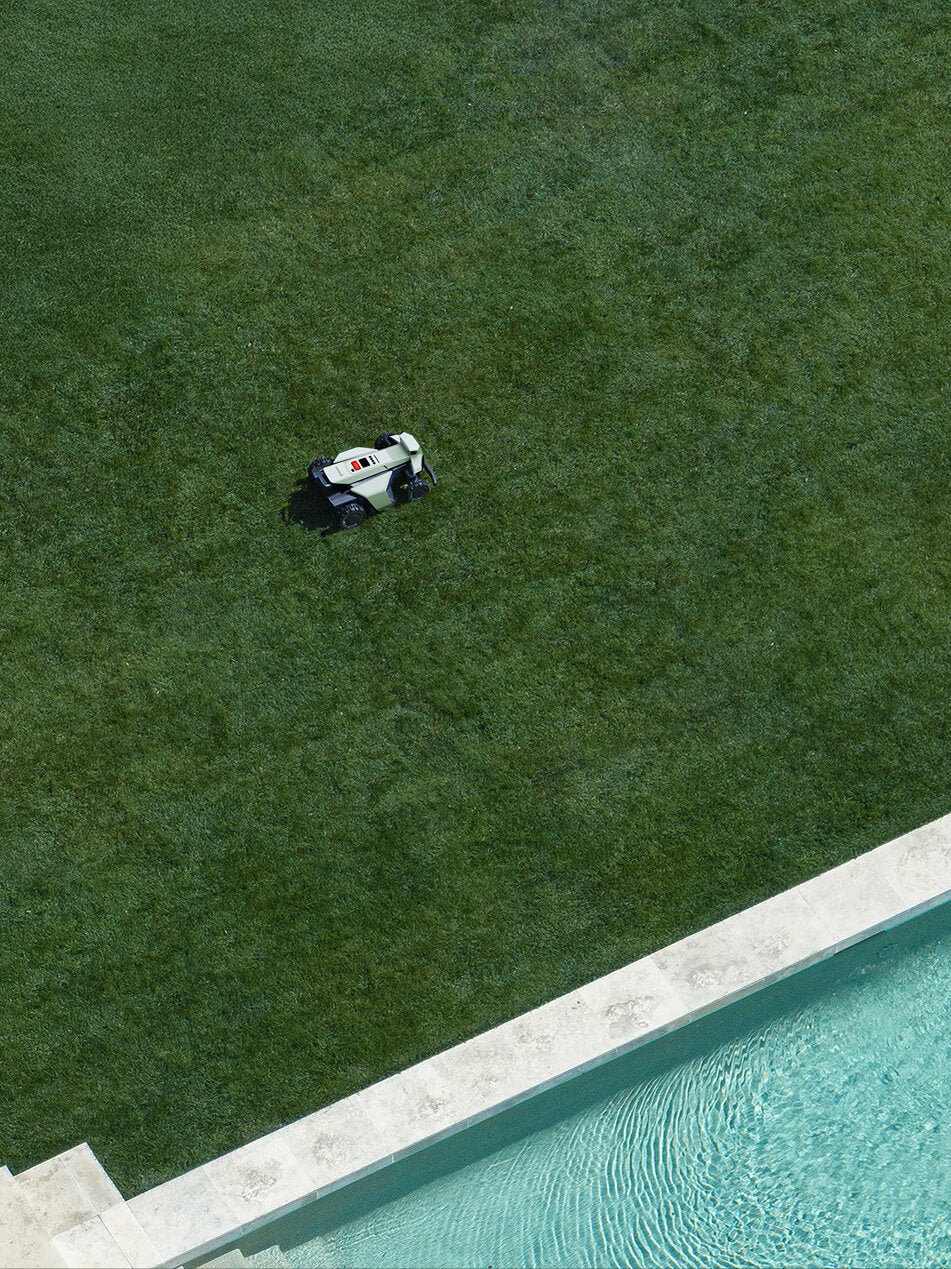 Segway Navimow i110N robot lawn mower mows the green lawn.